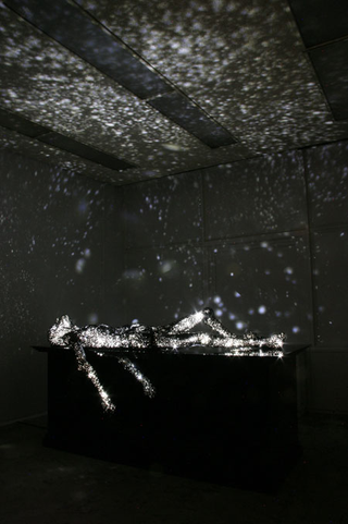 Illustration for article titled Sculptures of dying people double as wondrous star projectors